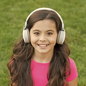 girl with headphones outside