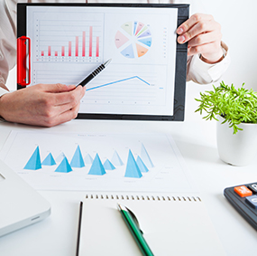 Staff member showing diagram of charts