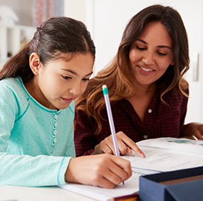 Teacher working with a student in the classroom