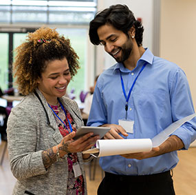 Two staff members talking to each other