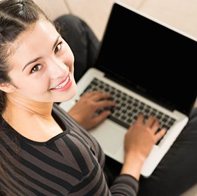 Happy women working on a laptop